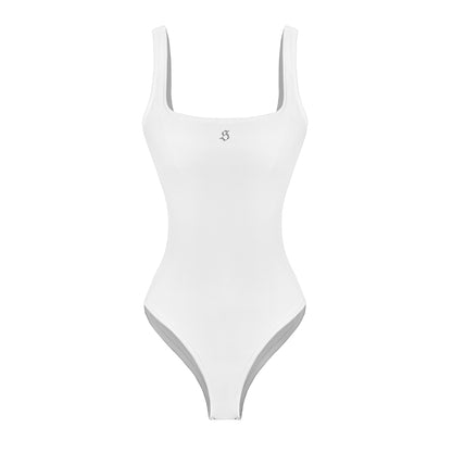 White swimsuit with thin straps on a white background