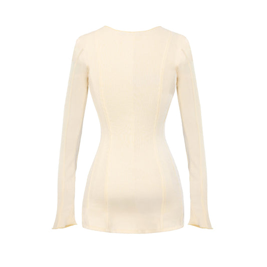Cream-colored long-sleeve top on a white background