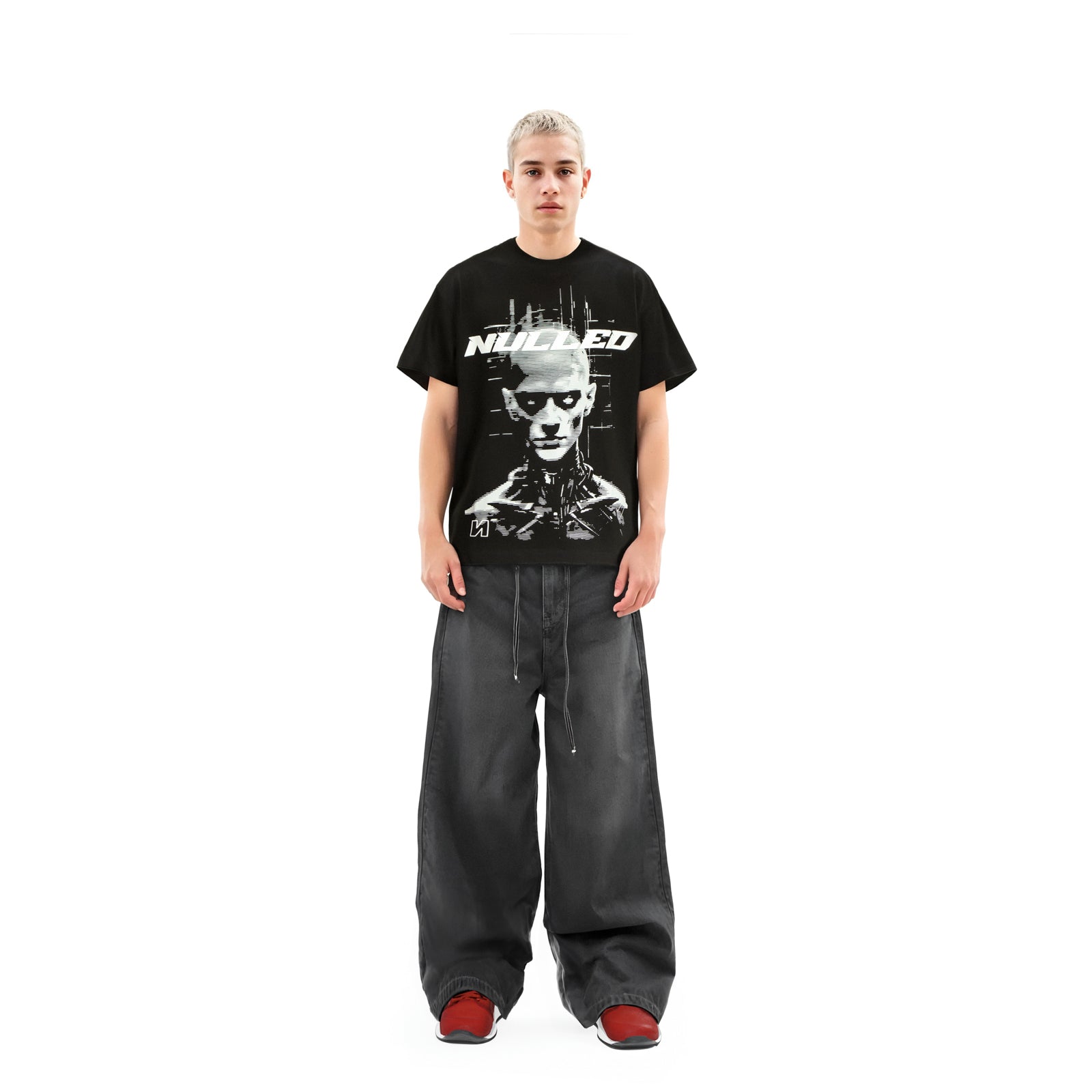 Person wearing a black t-shirt with a graphic design on a white background