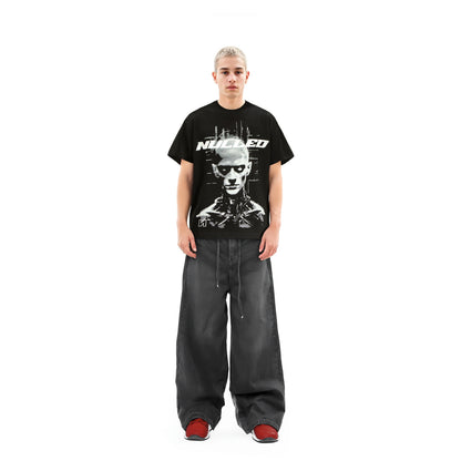 Person wearing a black t-shirt with a graphic design on a white background