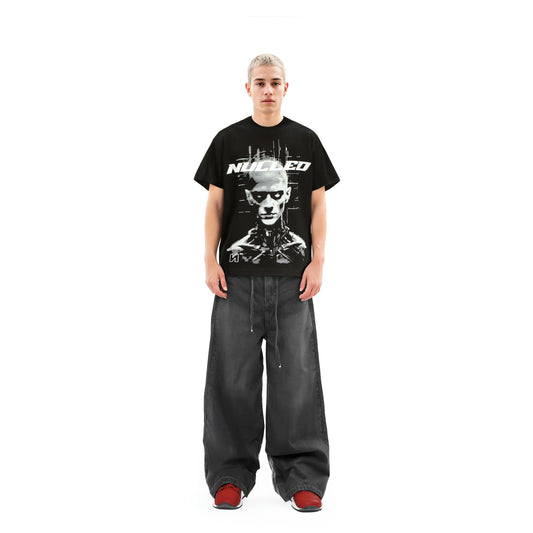 Person wearing a black t-shirt with a graphic design on a white background