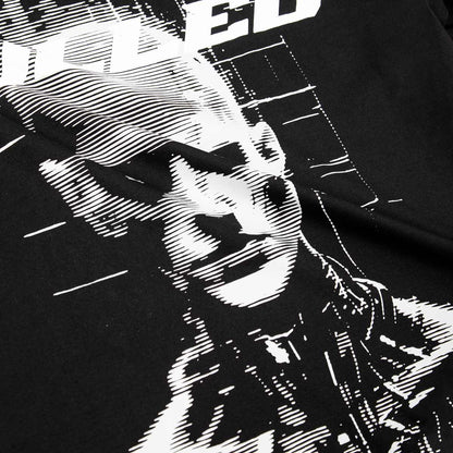 Black t-shirt with white graphic design of a person playing a guitar and the word 'SPEED' on a dark background.