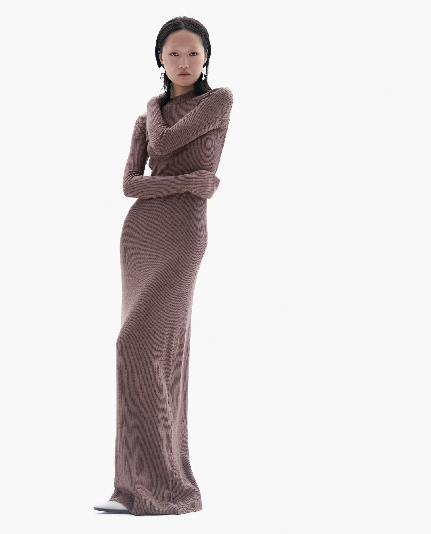 Model wearing backless ribbed knit maxi dress