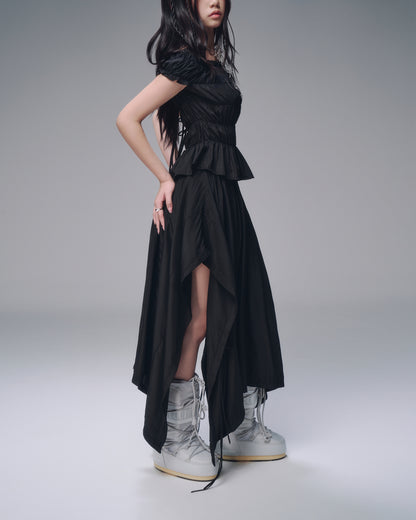 High-waisted black skirt – side view with soft drape