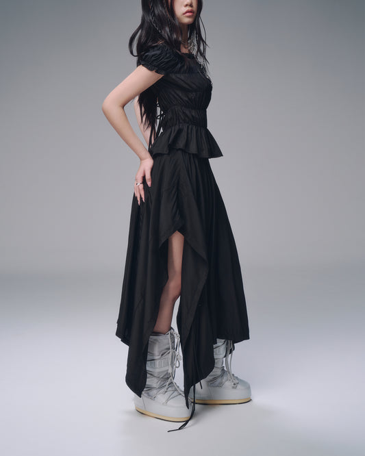 High-waisted black skirt – side view with soft drape