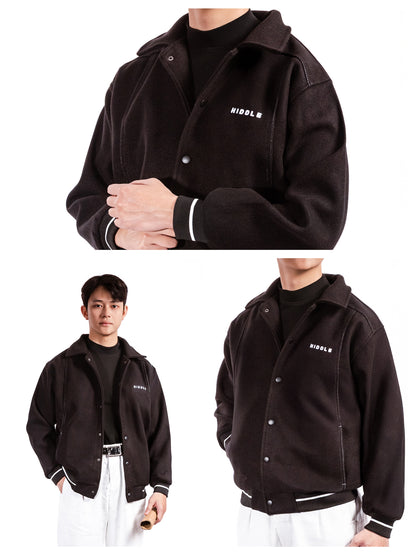 Black jacket with brand logo worn by a person on a white background