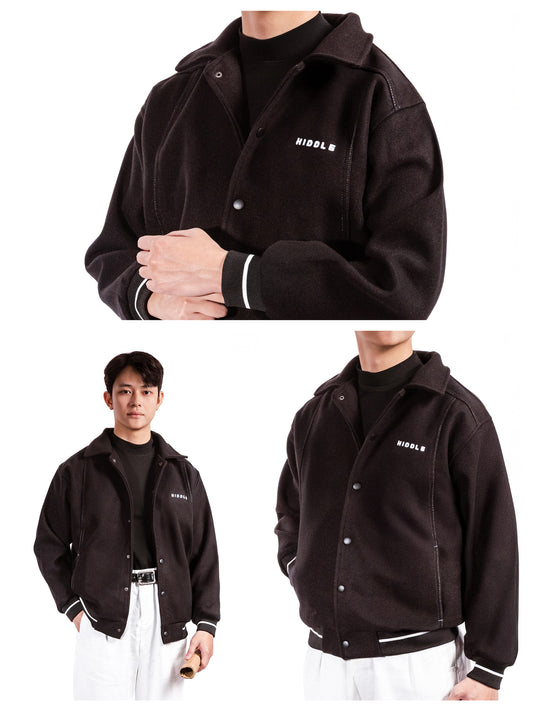 Black jacket with brand logo worn by a person on a white background