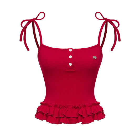 Red tank top with ruffled bottom and tied straps on a white background