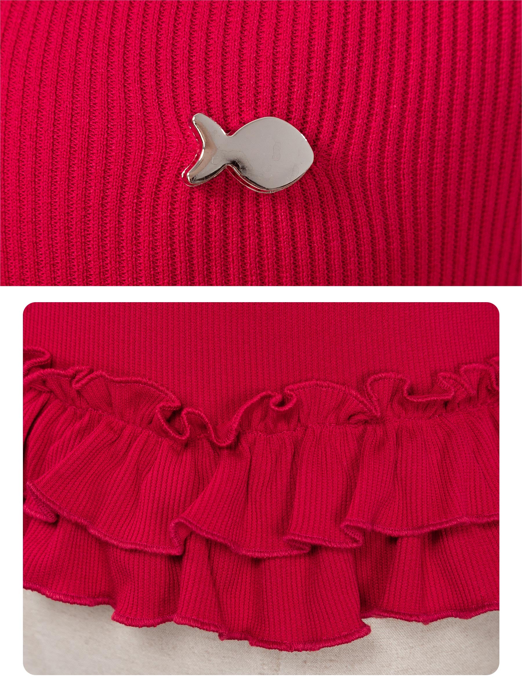 Red knit garment with a small decorative item on a red background