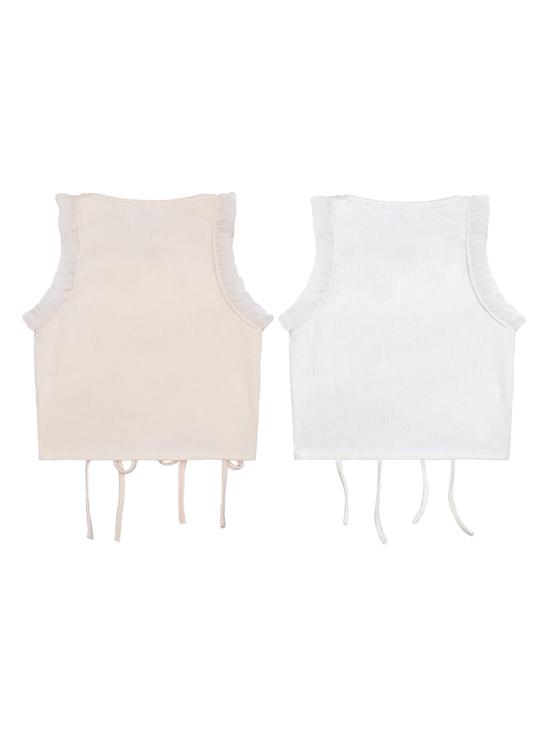 Two sleeveless tops, one beige and one white, on a white background