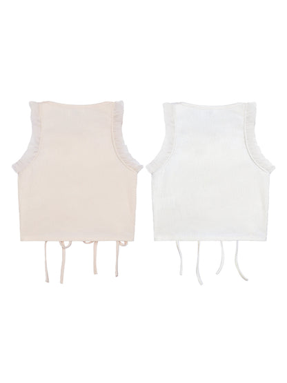 Two sleeveless tops, one beige and one white, on a white background