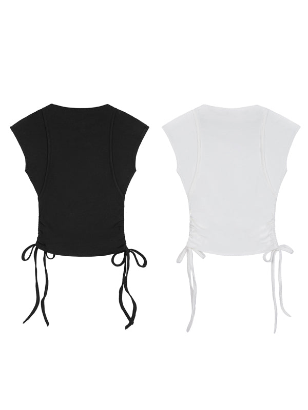 Black and white crop tops with tie details on a white background