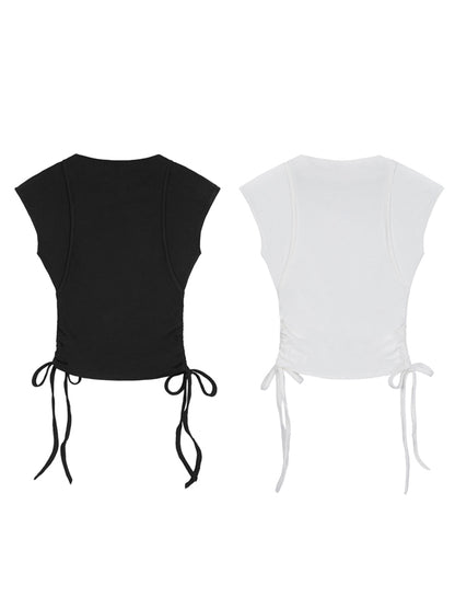 Black and white crop tops with tie details on a white background