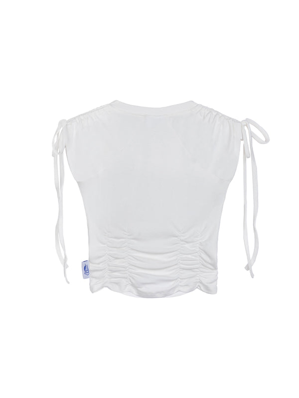 White sleeveless top with drawstring details on a white background