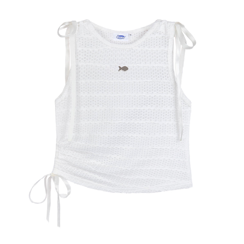 White sleeveless top with fish embroidery and tie straps on a white background