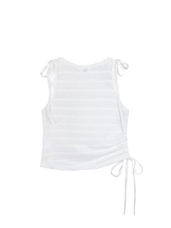 White sleeveless top with tie details on a white background