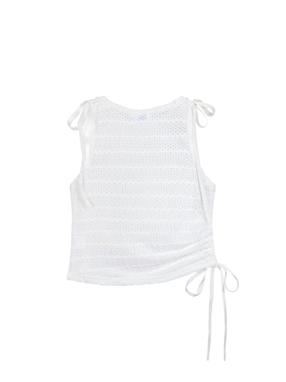 White sleeveless top with tie details on a white background