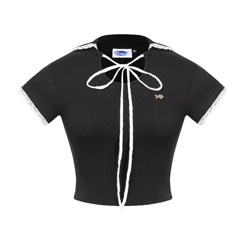 Black crop top with white lace details on a white background