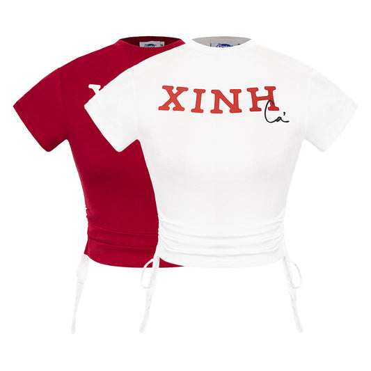 Two t-shirts, one red and one white, with 'XINH' printed on them.