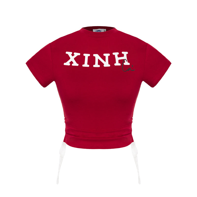 Red t-shirt with 'XINH' printed on it against a white background