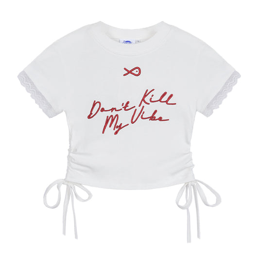 White crop top with red text 'Don't Kill My Vibe' on a white background