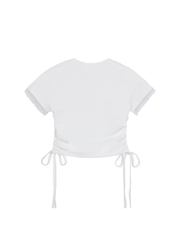 White crop top with tie details on a white background