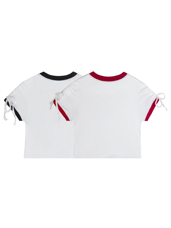 Two white t-shirts with red and black accents on a white background