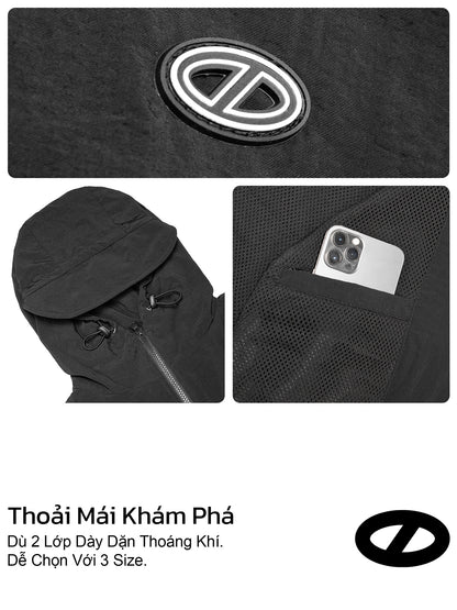 Black outdoor umbrella with a brand logo, pocket for a phone, and text in a foreign language.