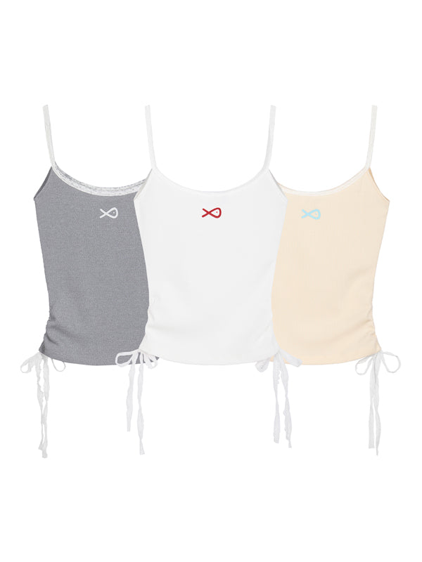 Three tank tops in gray, white, and beige with unique symbols on a white background