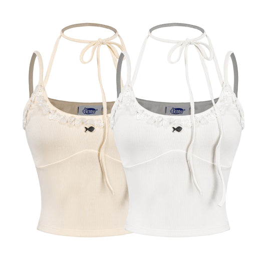 Two crop tops, one beige and one white, with thin straps and a brand label on a white background.