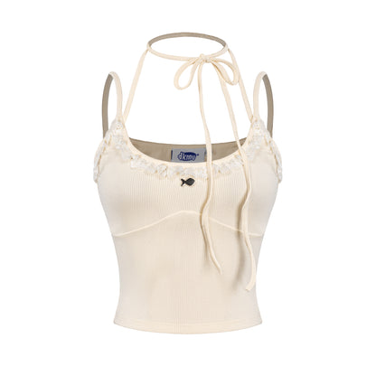 Beige crop top with thin straps on a white background