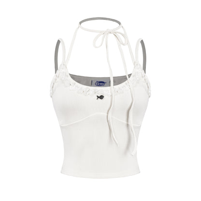 White tank top with thin straps on a white background