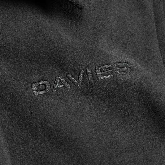 Close-up of a textured fabric surface with 'DAVIES' branding.