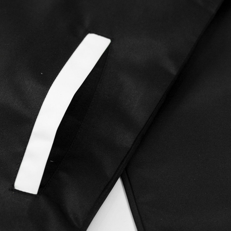 Close-up of black fabric with a white stripe