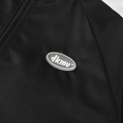 Black jacket with a silver logo on a white background