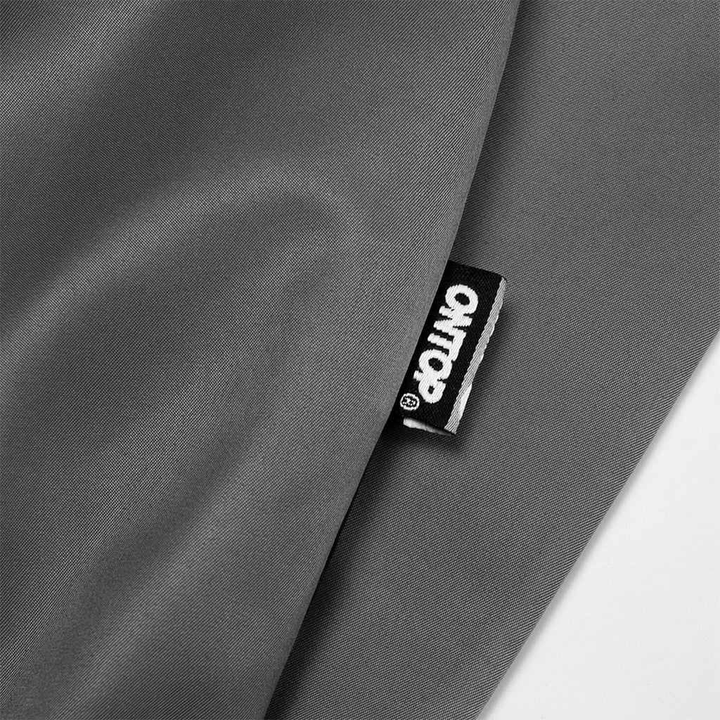 Gray fabric with a brand label on a white background