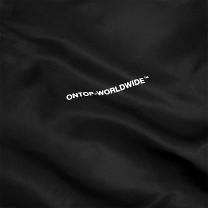Black fabric with 'ONTOP-WORLDWIDE' text embroidered on it