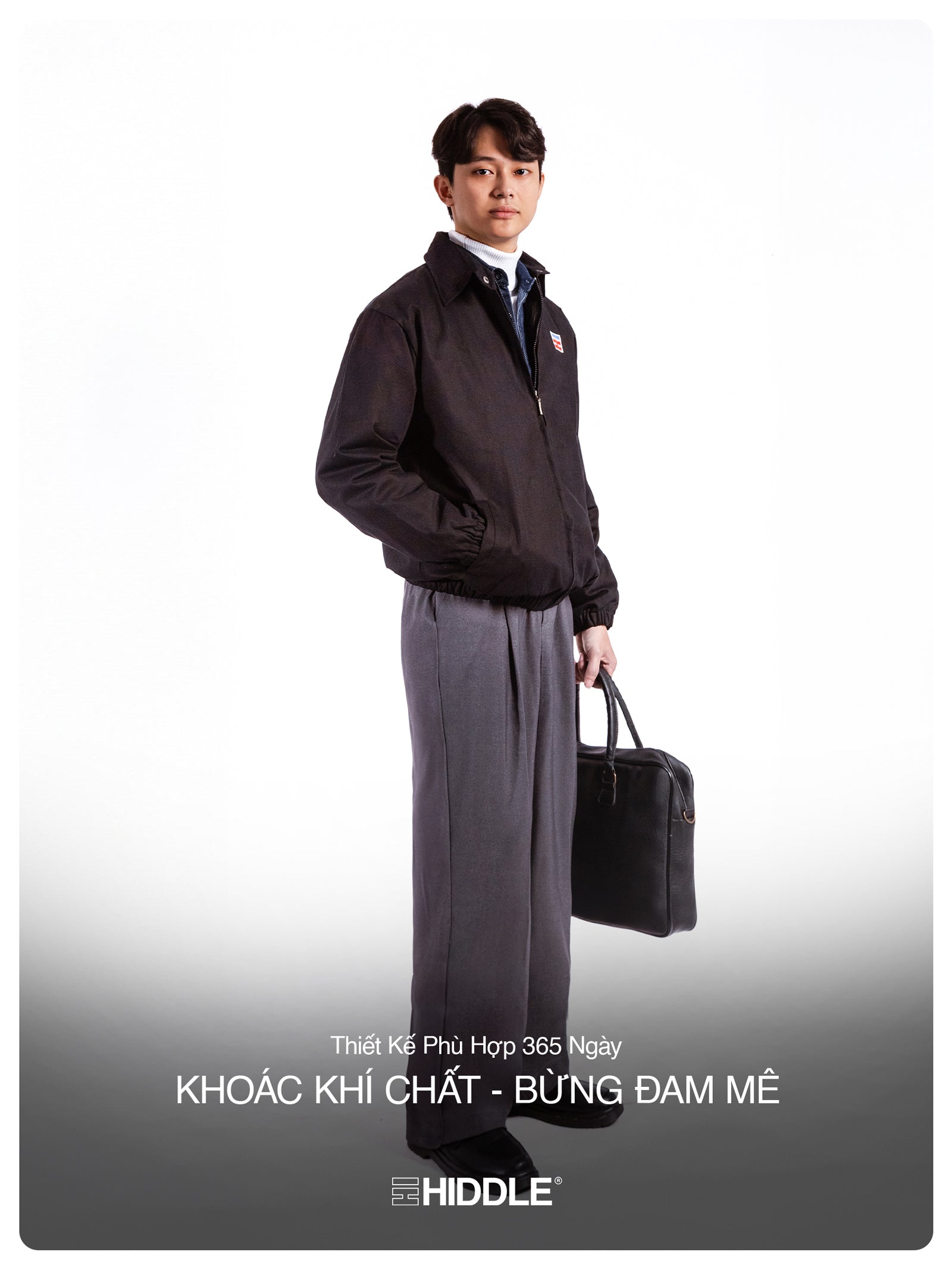 Man in a suit holding a briefcase with Hiddle branding on a white background