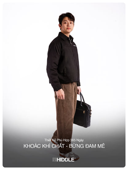 Man holding a briefcase against a white background with Hiddle branding.
