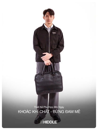 Man holding a black briefcase against a white background, with text overlay.