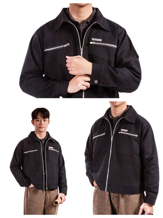 Black jacket with white zippers worn by a person on a white background