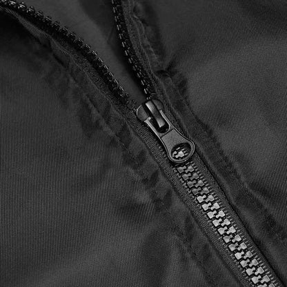 Close-up of a black zipper on a black fabric background