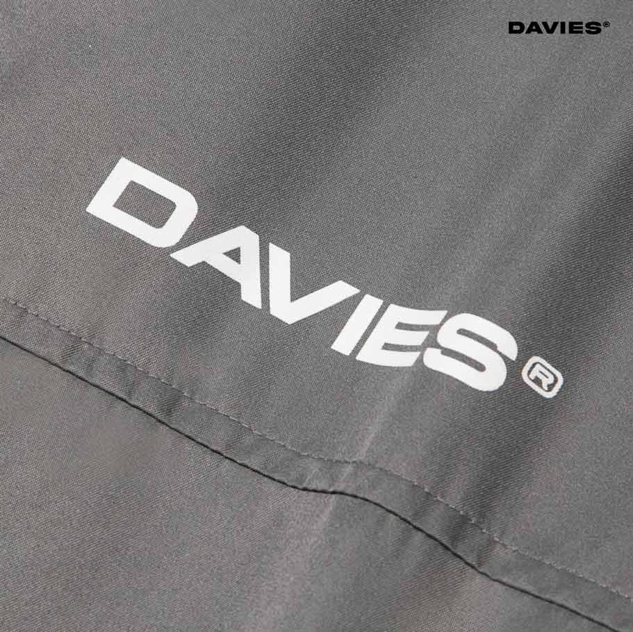 Close-up of a gray fabric with 'DAVIES' logo in white.