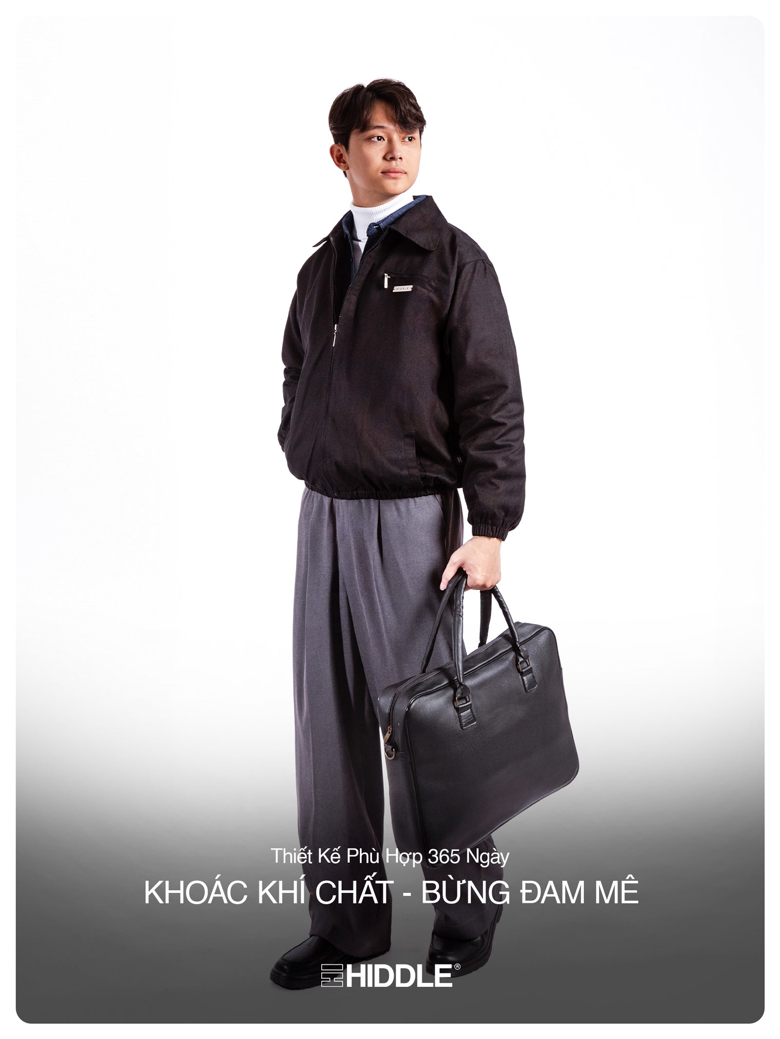Man in a dark jacket and gray pants holding a briefcase against a white background, with 'Hiddle' branding.