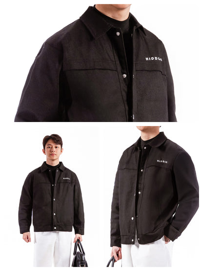 Black jacket with brand logo worn by a person on a white background