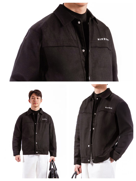 Black jacket with brand logo worn by a person on a white background