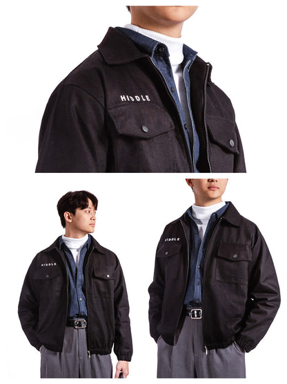Black jacket with 'HIDDE' branding worn by a person on a white background