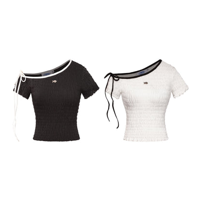 Black and white short-sleeve tops with unique cut-out shoulders on a white background