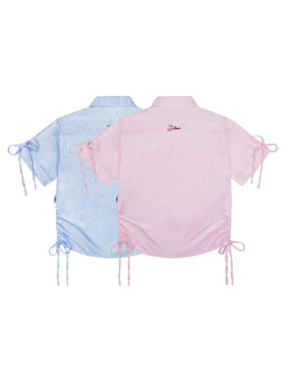 Two short-sleeve tops, one blue and one pink, on a white background.