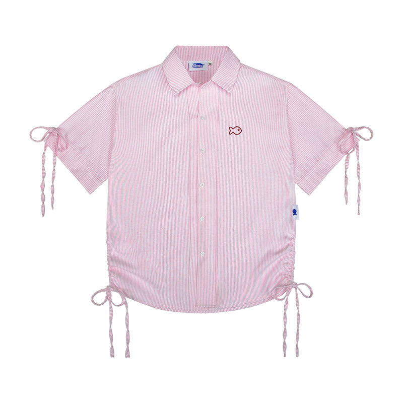 Pink checkered shirt with fish embroidery on a white background